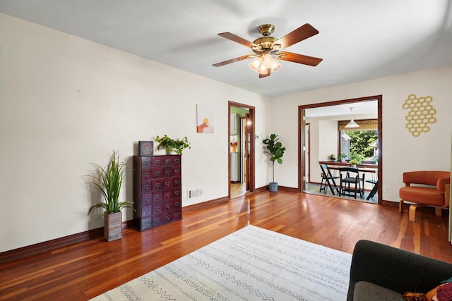 129 Division St, Madison, WI 53704 - living room featuring wood finished floors and a ceiling fan
