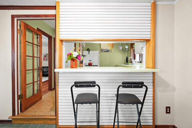 129 Division St, Madison, WI 53704 - kitchen with freestanding refrigerator and a sink