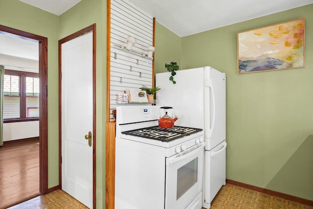129 Division St, Madison, WI 53704 - kitchen with white gas range and tile patterned floors