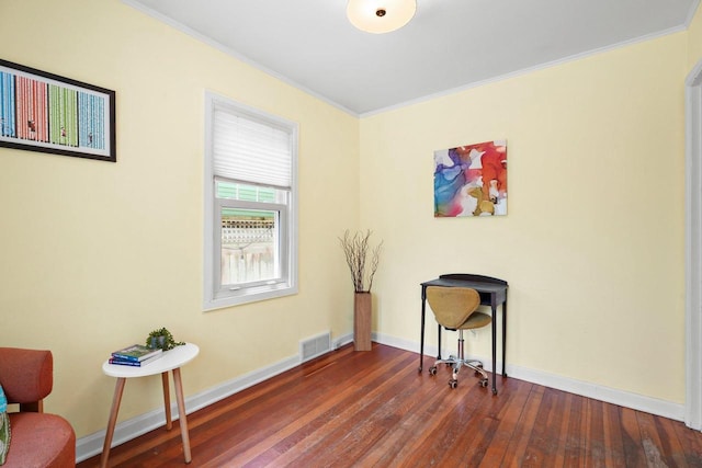 129 Division St, Madison, WI 53704 - living area featuring dark wood-style floors and ornamental molding