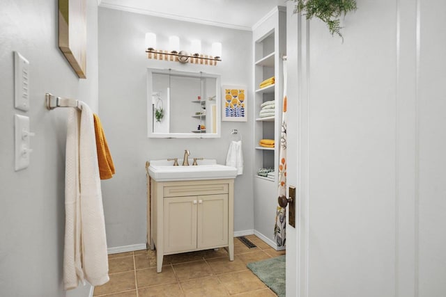 129 Division St, Madison, WI 53704 - bathroom with vanity and tile patterned floors