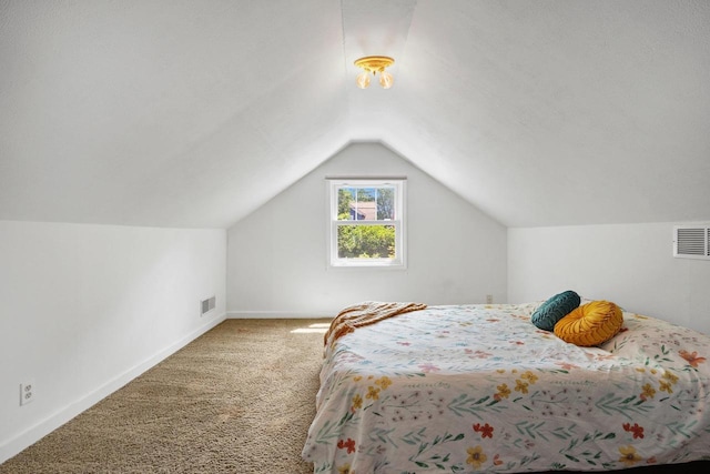 129 Division St, Madison, WI 53704 - carpeted bedroom featuring lofted ceiling and baseboards