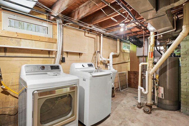 129 Division St, Madison, WI 53704 - laundry room featuring gas water heater and washing machine and clothes dryer