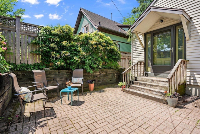 129 Division St, Madison, WI 53704 - fenced backyard featuring a patio area and entry steps