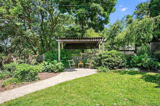 129 Division St, Madison, WI 53704 - fenced yard featuring a patio, view of scattered trees, and a pergola