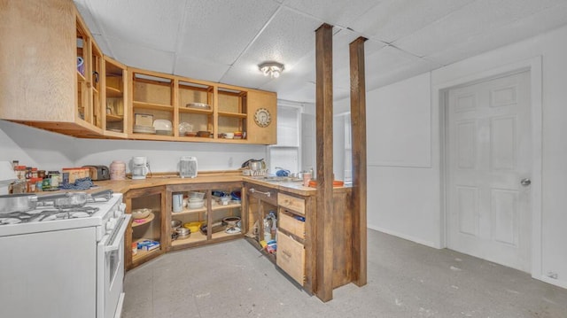 613 N 5th St Unit 611, Sheboygan, WI 53081 - kitchen featuring white range with gas cooktop, a drop ceiling, open shelves, and light countertops