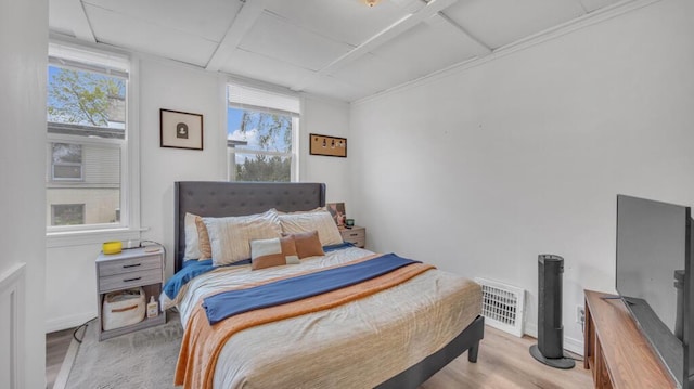 613 N 5th St Unit 611, Sheboygan, WI 53081 - bedroom with multiple windows, light wood-type flooring, and coffered ceiling