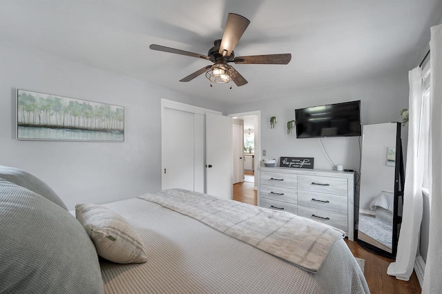 3813 S Clay St, Green Bay, WI 54301 - bedroom with dark wood-type flooring, ceiling fan, and a closet