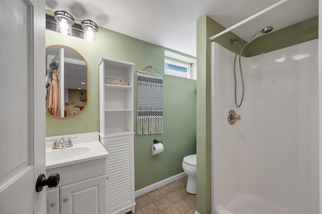3813 S Clay St, Green Bay, WI 54301 - bathroom featuring a shower, toilet, vanity, and tile patterned flooring