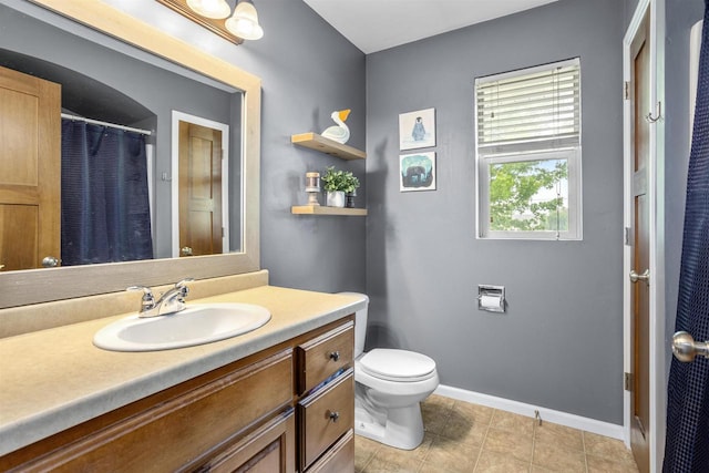 763 Severndroog Way, Howard, WI 54313 - full bathroom with vanity, toilet, baseboards, tile patterned floors, and a shower with curtain