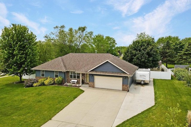 763 Severndroog Way, Howard, WI 54313 - ranch-style home featuring an attached garage, brick siding, concrete driveway, and roof with shingles
