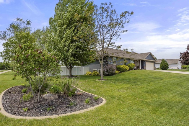 763 Severndroog Way, Howard, WI 54313 - view of front of house with an attached garage, a front lawn, and driveway