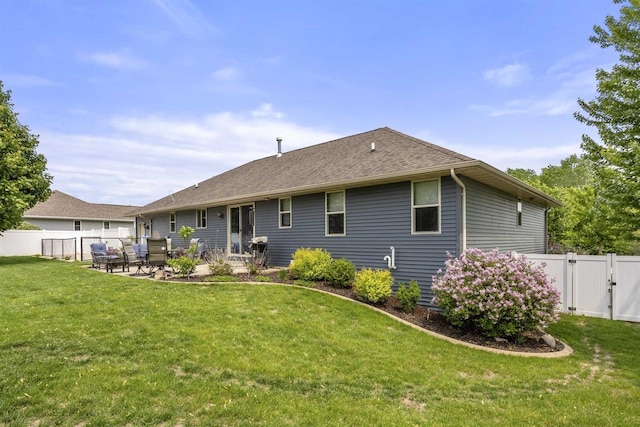 763 Severndroog Way, Howard, WI 54313 - back of property featuring a gate, a patio, and a shingled roof