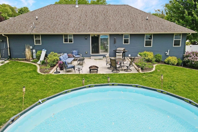 763 Severndroog Way, Howard, WI 54313 - rear view of house featuring a fire pit, a yard, a patio area, and a shingled roof