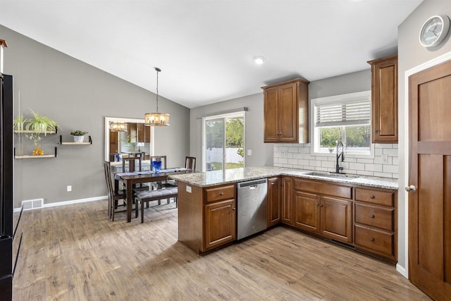 763 Severndroog Way, Howard, WI 54313 - kitchen with dishwasher, a sink, brown cabinets, a peninsula, and light wood-style floors