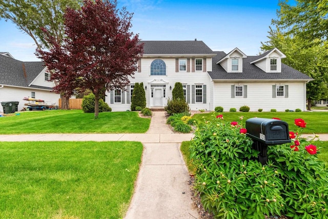 139 Sullivan Ln, De Pere, WI 54115 - colonial inspired home with a front yard and a shingled roof