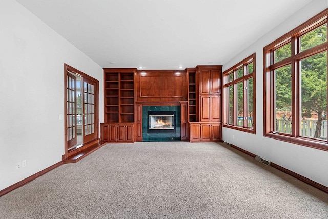 139 Sullivan Ln, De Pere, WI 54115 - unfurnished living room with a premium fireplace, plenty of natural light, and baseboards