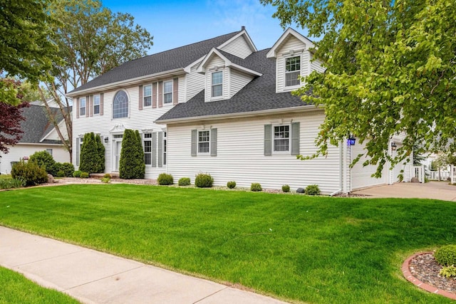 139 Sullivan Ln, De Pere, WI 54115 - view of front of home with a shingled roof, concrete driveway, and a front lawn
