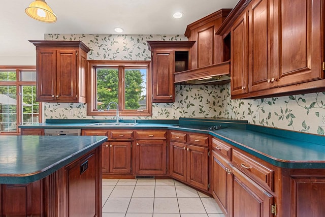 139 Sullivan Ln, De Pere, WI 54115 - kitchen featuring dark countertops, a sink, healthy amount of natural light, light tile patterned floors, and wallpapered walls