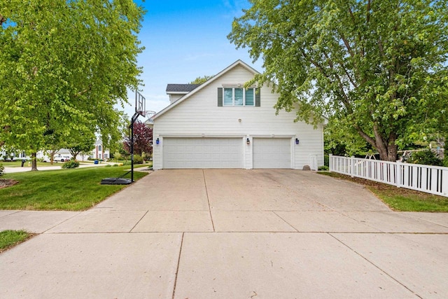 139 Sullivan Ln, De Pere, WI 54115 - view of side of property with concrete driveway and a garage