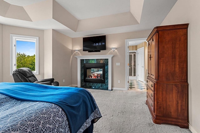 139 Sullivan Ln, De Pere, WI 54115 - bedroom with light colored carpet, baseboards, a fireplace, and a tray ceiling