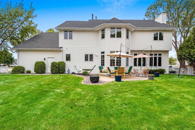 139 Sullivan Ln, De Pere, WI 54115 - rear view of house with a chimney, a patio, and a shingled roof
