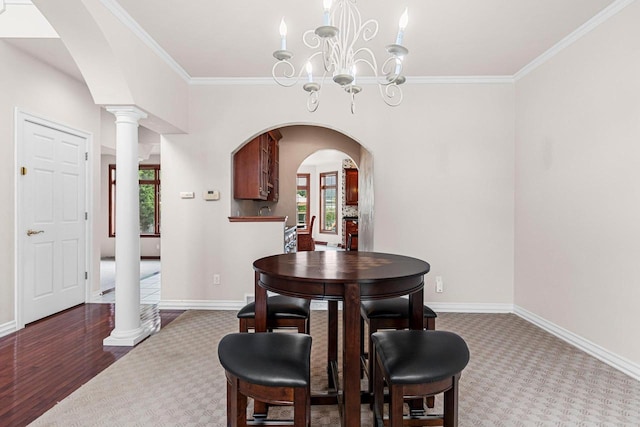 139 Sullivan Ln, De Pere, WI 54115 - dining room featuring arched walkways, plenty of natural light, crown molding, carpet flooring, and baseboards