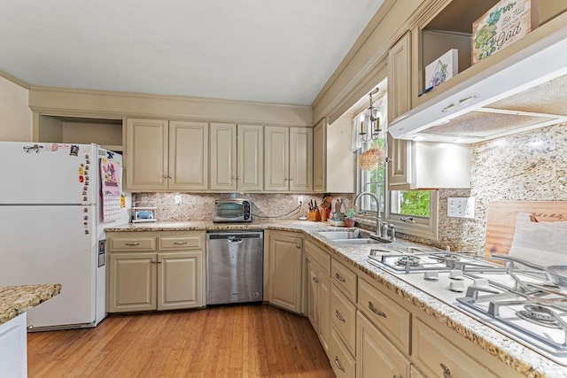 1123 S Park Ave, Neenah, WI 54956 - kitchen with white appliances, a sink, custom exhaust hood, tasteful backsplash, and light wood-style floors