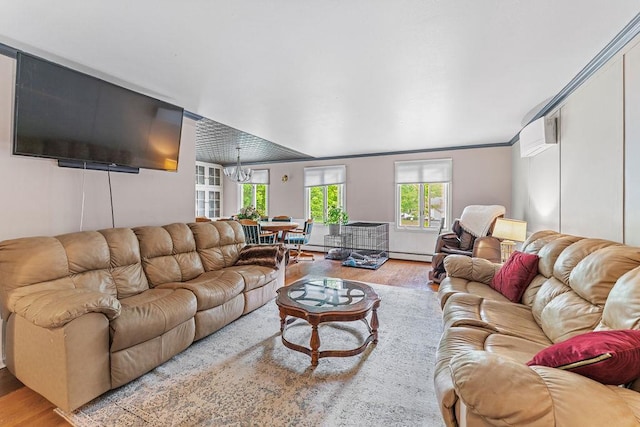 1123 S Park Ave, Neenah, WI 54956 - living room with wood finished floors, baseboard heating, a chandelier, and crown molding