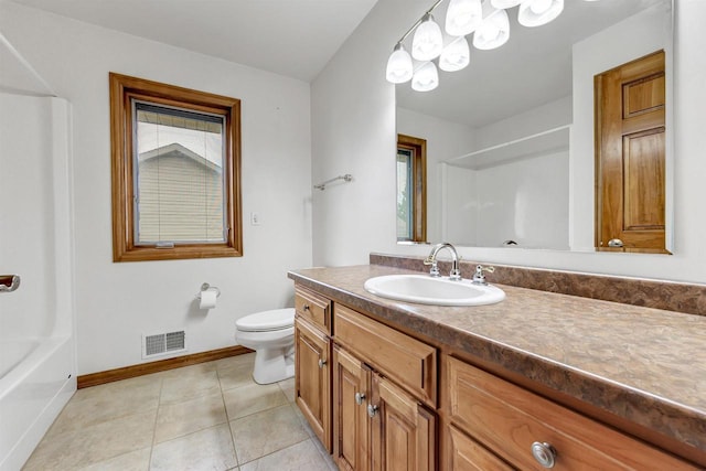 1411 Cocos, Green Bay, WI 54313 - bathroom with baseboards, vanity, toilet, tile patterned flooring, and  shower combination