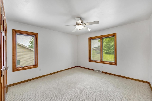 1411 Cocos, Green Bay, WI 54313 - empty room with carpet, baseboards, and ceiling fan