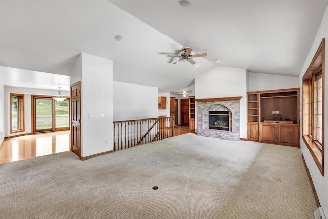 1411 Cocos, Green Bay, WI 54313 - unfurnished living room with a ceiling fan, vaulted ceiling, carpet flooring, baseboards, and a brick fireplace
