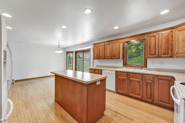 1411 Cocos, Green Bay, WI 54313 - kitchen with white appliances, a sink, a kitchen island, plenty of natural light, and recessed lighting