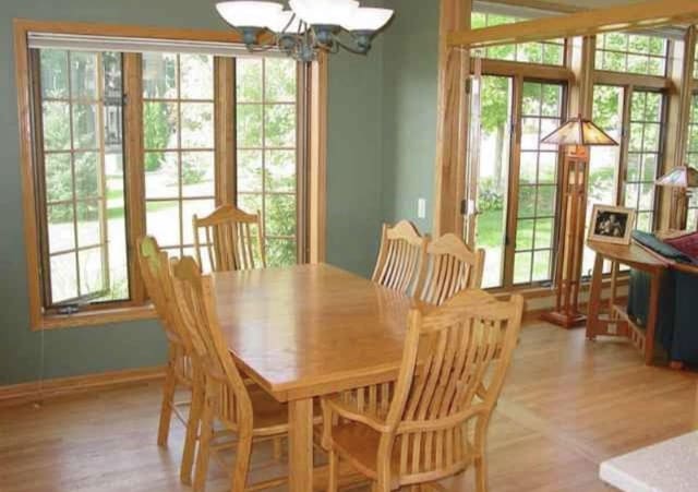 10 Vienna Cir, Madison, WI 53718 - dining area with a chandelier and light wood-style flooring