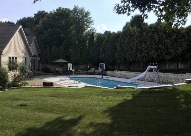 10 Vienna Cir, Madison, WI 53718 - view of swimming pool with a water slide, a fenced backyard, and a patio