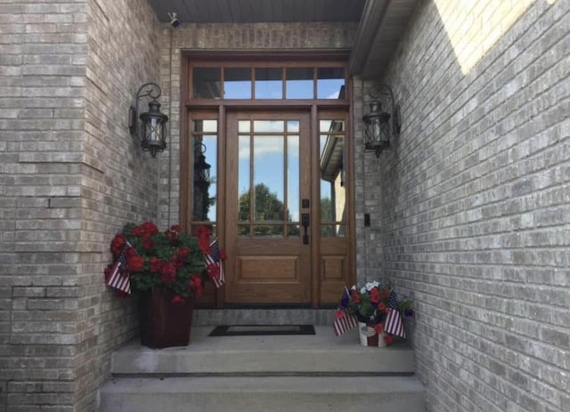 10 Vienna Cir, Madison, WI 53718 - doorway to property featuring brick siding