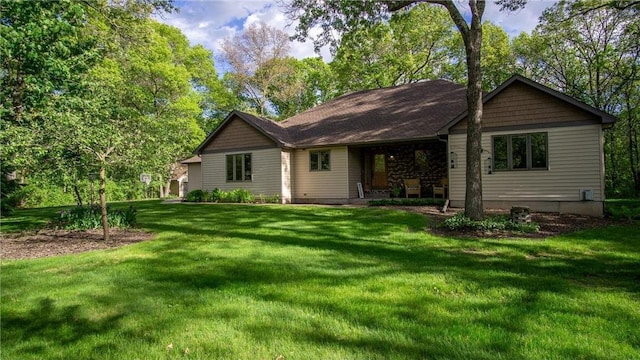 E3313 Jennifer Ln, Eau Claire, WI 54701 - rear view of property featuring a lawn