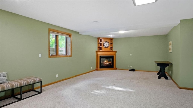 E3313 Jennifer Ln, Eau Claire, WI 54701 - unfurnished room with a glass covered fireplace, carpet flooring, and baseboards