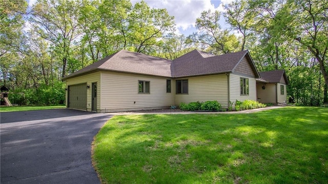 E3313 Jennifer Ln, Eau Claire, WI 54701 - ranch-style home featuring a front lawn, a garage, and driveway