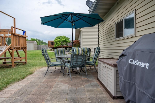 2371 Doris Rd, Reedsburg, WI 53959 - view of patio with outdoor dining area, a playground, and area for grilling