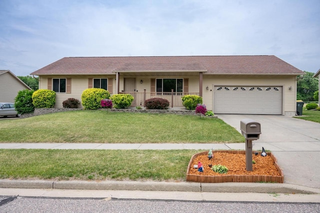 2371 Doris Rd, Reedsburg, WI 53959 - single story home featuring an attached garage, driveway, a front lawn, covered porch, and roof with shingles