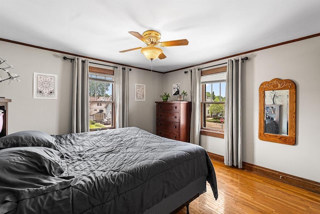 157 E 11th St, Fond Du Lac, WI 54935 - bedroom with baseboards, ornamental molding, light wood-style flooring, and ceiling fan