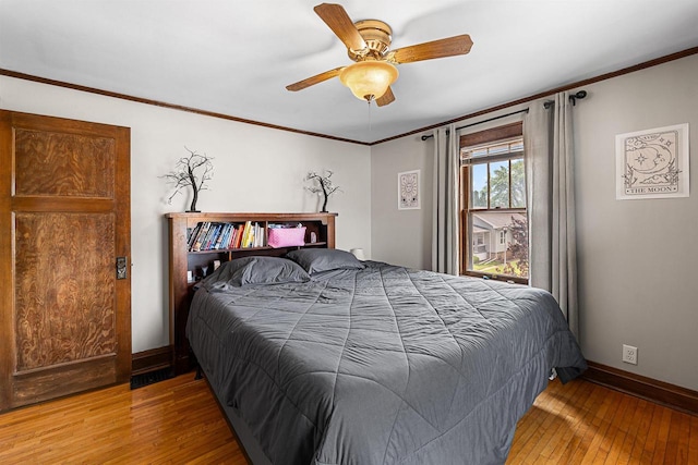 157 E 11th St, Fond Du Lac, WI 54935 - bedroom with hardwood / wood-style floors, baseboards, crown molding, and ceiling fan