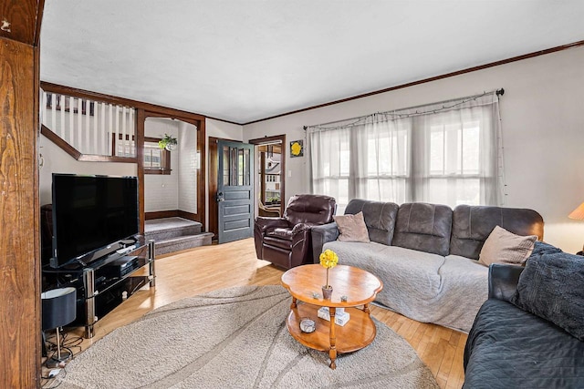 157 E 11th St, Fond Du Lac, WI 54935 - living area with plenty of natural light, stairs, wood finished floors, and ornamental molding