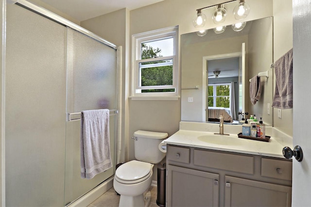 20506 83rd Pl, Bristol, WI 53104 - bathroom with vanity, a stall shower, toilet, and a ceiling fan