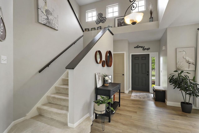 20506 83rd Pl, Bristol, WI 53104 - entrance foyer with baseboards, stairs, hardwood / wood-style flooring, and a towering ceiling