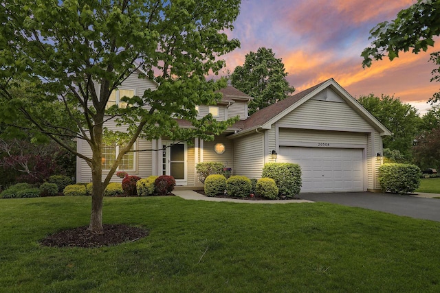 20506 83rd Pl, Bristol, WI 53104 - view of front of property with asphalt driveway, an attached garage, and a front lawn