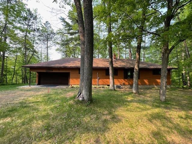 11176 W Plover Ln, Hayward, WI 54843 - view of front of house with a front yard, driveway, and a garage