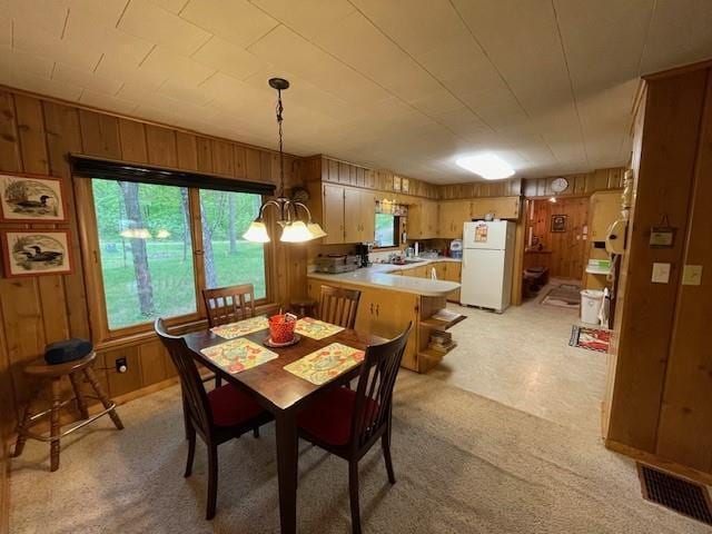 11176 W Plover Ln, Hayward, WI 54843 - dining room featuring wooden walls and light carpet