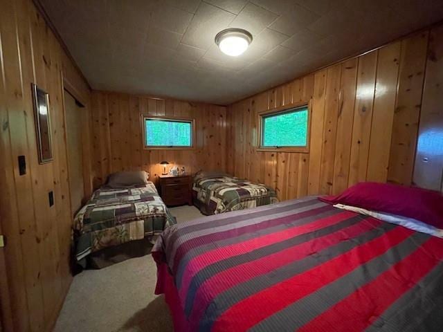 11176 W Plover Ln, Hayward, WI 54843 - bedroom featuring carpet flooring and wooden walls